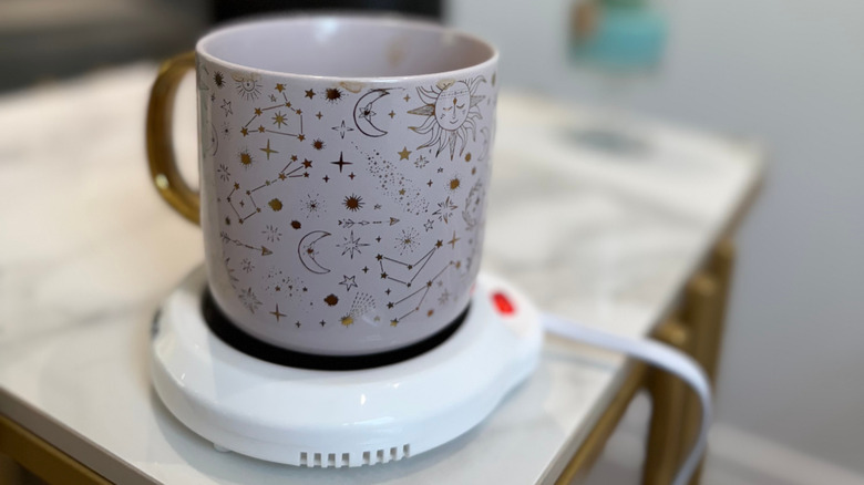 A mug on top of a mug warmer