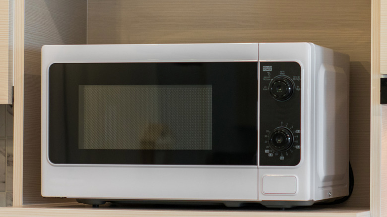 a vintage microwave in a kitchen