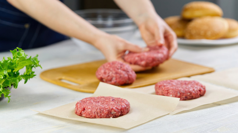 Person making burgers