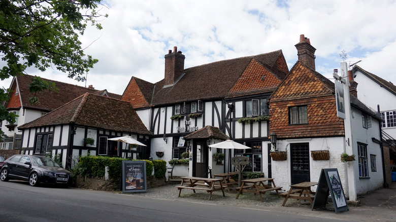 Exterior of The White Horse Pub, a very large old English manor-like building