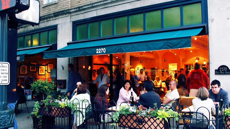 The exterior of Giuseppe's Ritrovo with diners eating al fresco