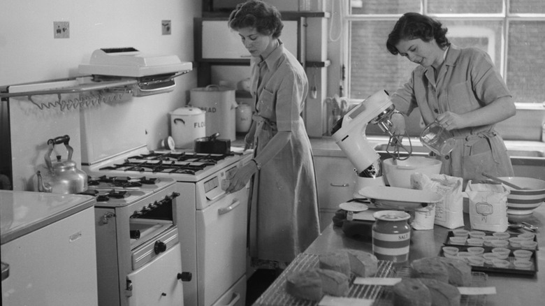 An old gas stove in a 1950s kitchen in black and white