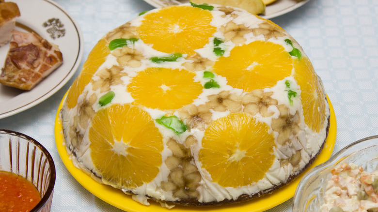 Orange gelatin upside-down pie on a yellow plate