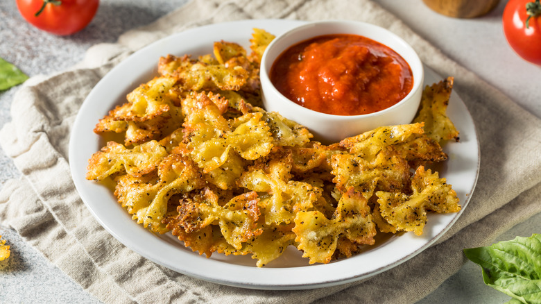 Pasta chips with marinara sauce