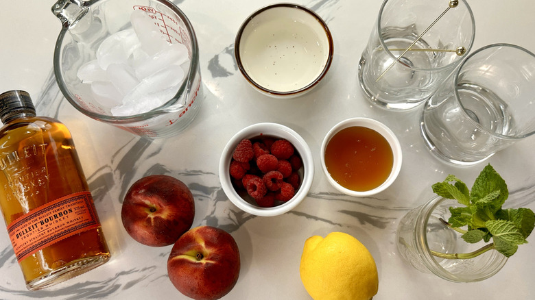 Ingredients for peach and raspberry bourbon smash
