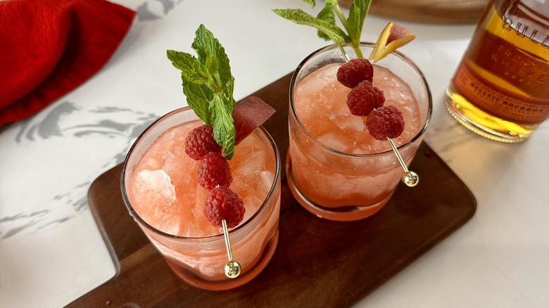 Peach and raspberry bourbon smash