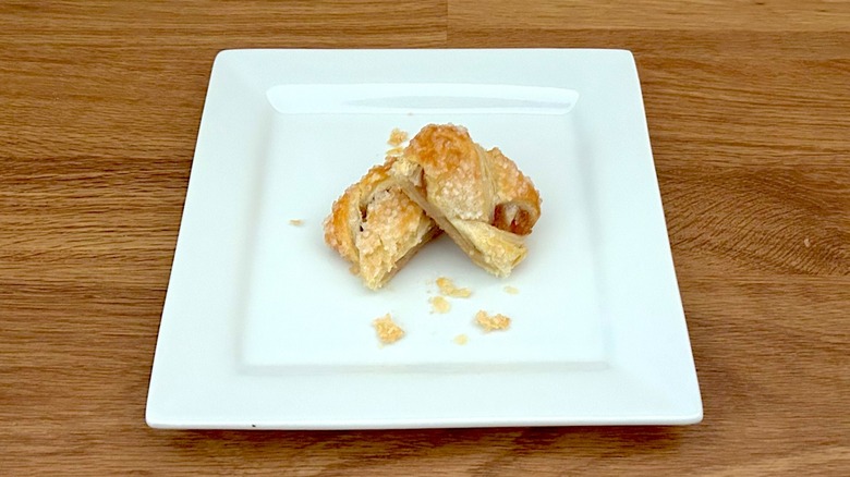 Square white plate with a halved Caramel Apple Strudel Bite from Costco