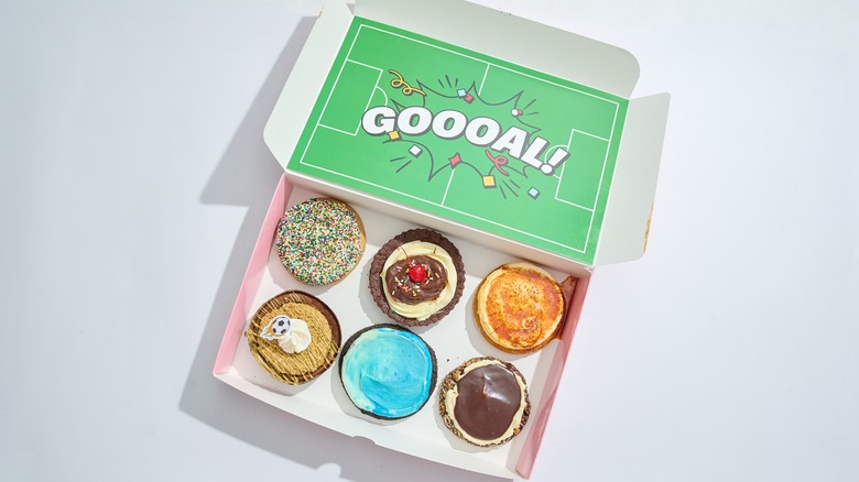 crumbl cookie world cup box filled with cookies on a table