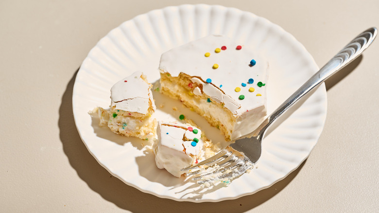 Eating a Birthday Cake snack on a plate with a fork