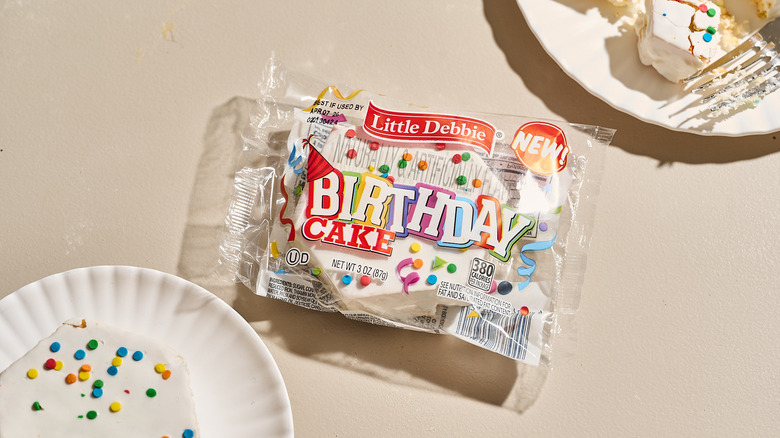 Packaged little debbie birthday cake on a table