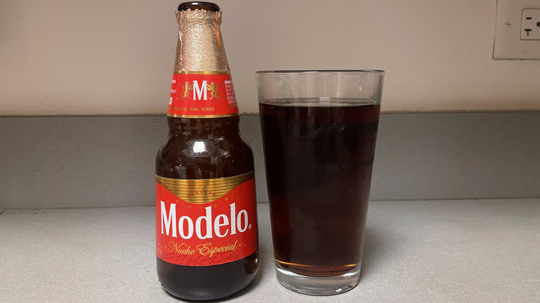 An open bottle of Modelo® Noche Especial and a glass of beer
