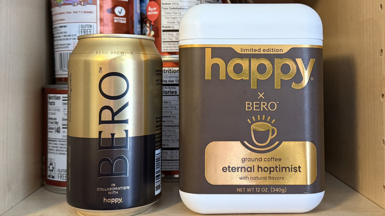 A cabinet with the Bero x Happy can and canister on a shelf