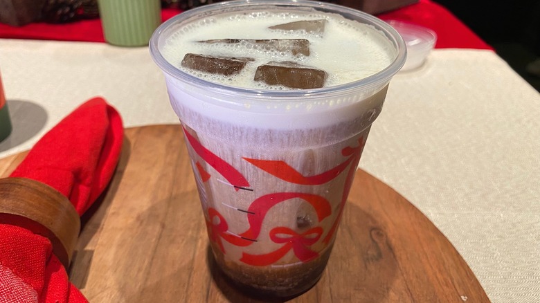 Iced coffee drink on wooden board