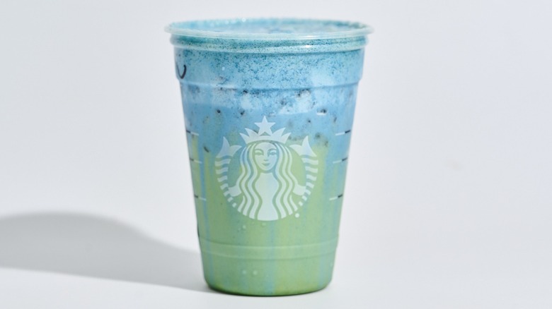 blue coconut matcha in a starbucks cup on a table