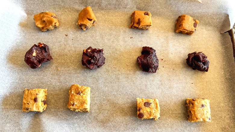 Cookie dough pieces on a baking sheet