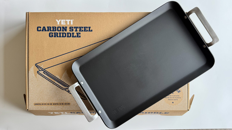 Yeti carbon steel griddle pan on white background with packaging