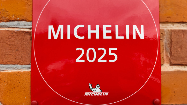 A Red Michelin 2025 plaque on a brick wall