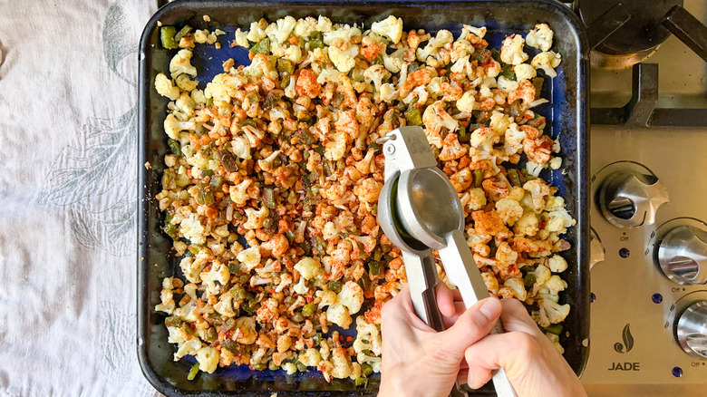 Squeezing lime juice over chopped vegetables