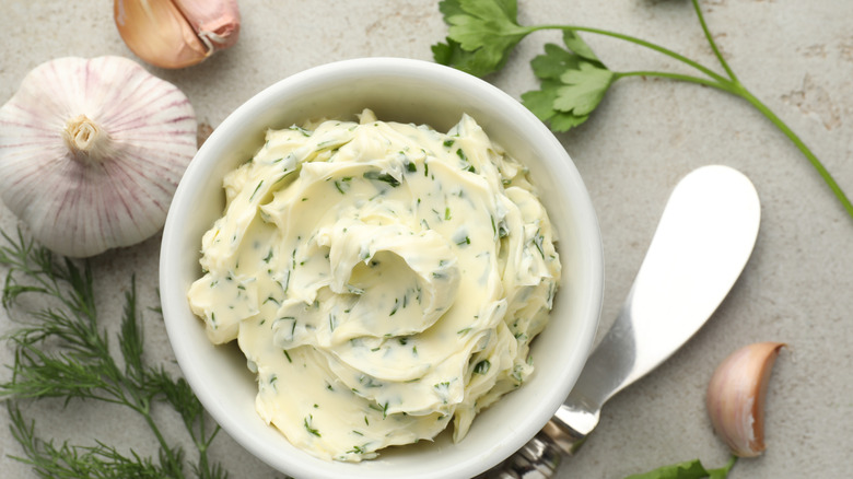herb infused butter sits in a bowl