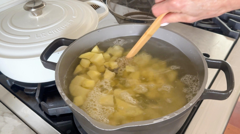 potatoes in pot boiling