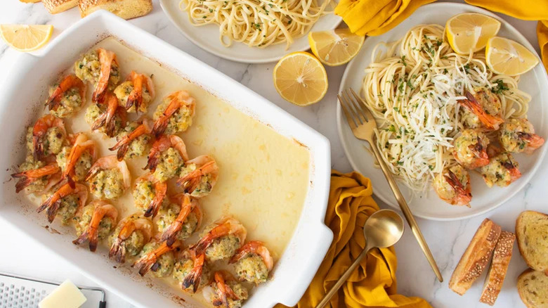Baked Stuffed shrimp scampi in a dish.