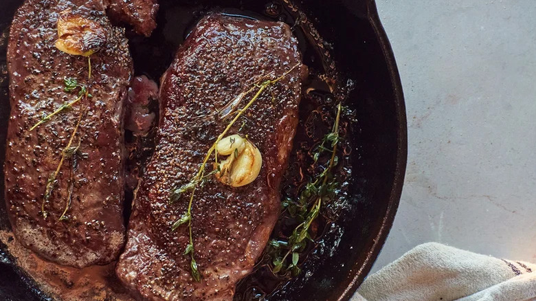 Steak in a cast iron pan.