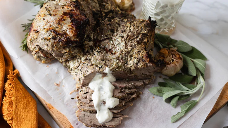 Leg of lamb on a parchment sheet.