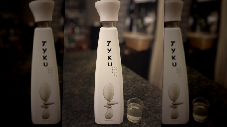 A bottle of TYKU White on a countertop