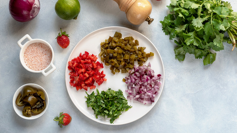 ingredients for strawberry salsa on a plate