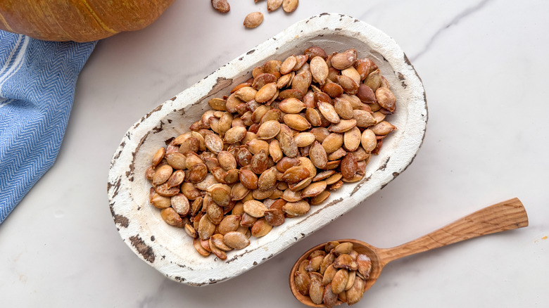 Salt and vinegar pumpkin seeds in serving dish