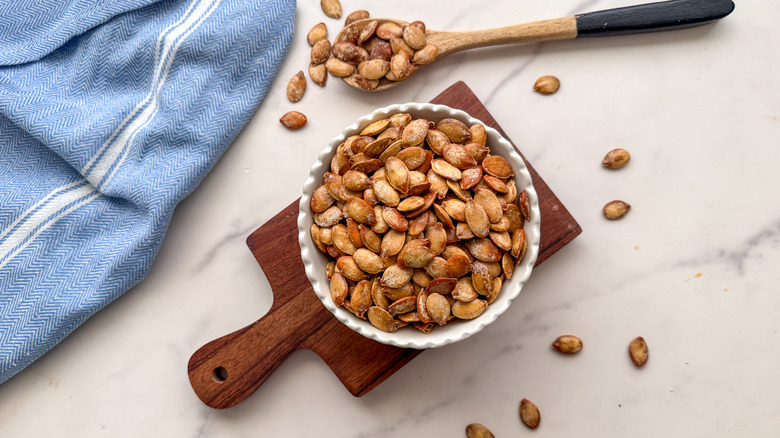 Bowl of roasted pumpkin seeds in bowl