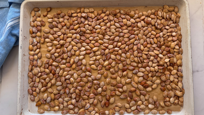 Roasted pumpkin seeds on sheet pan