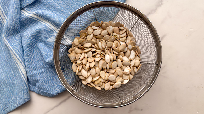 Pumpkin seeds in colander