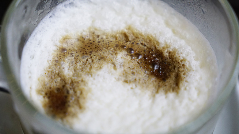Salted creamy foam on coffee