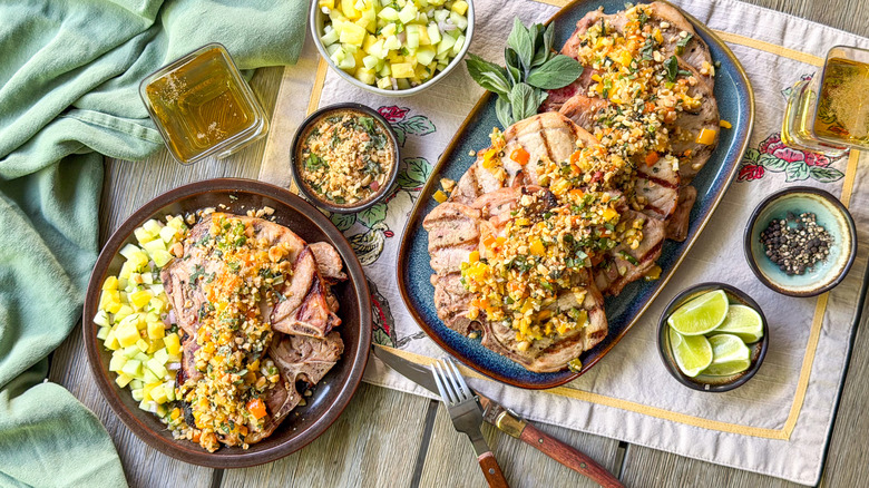 Sambal matah-ish grilled pork chops on serving platter and plate with garnishes