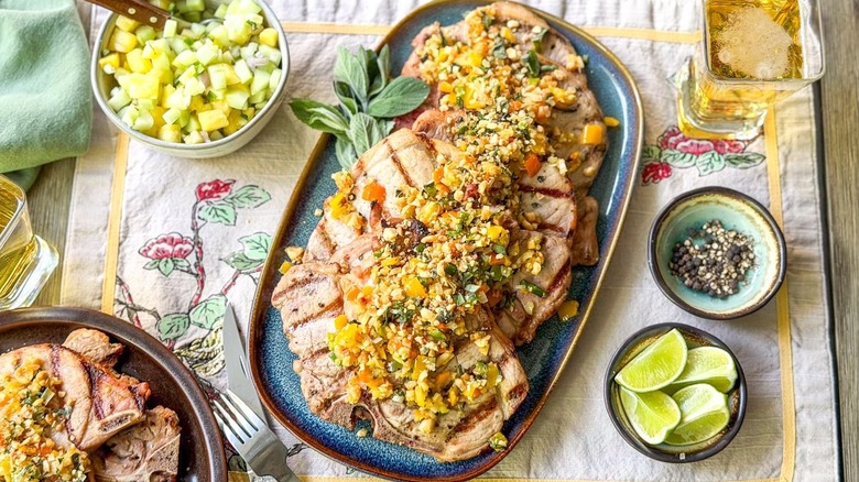 Sambal matah-ish grilled pork chops on serving platter with garnishes