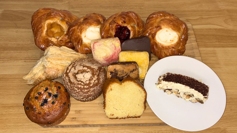 A variety of pastries laid out on a cutting board.