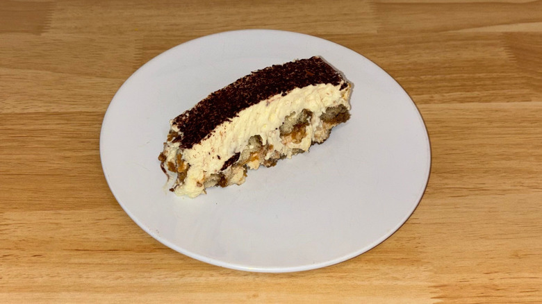 A slice of tiramusu on a white plate.