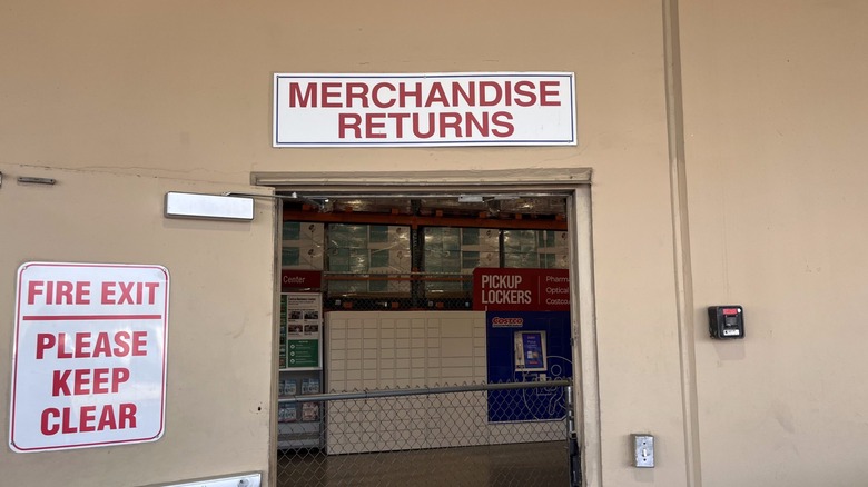 Merchandise returns sign at Costco above open warehouse door