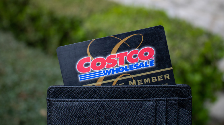 A Costco Executive Membership card sticks out of a wallet