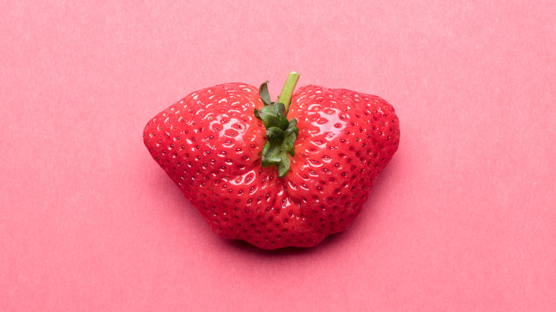 Close-up of a strange-looking strawberry