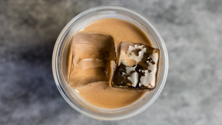 Iced coffee mocha viewed from the top against gray background