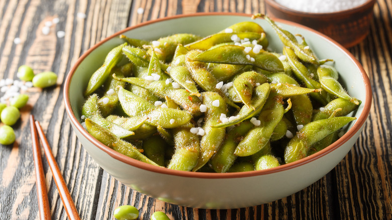 White bowl of salted edamame