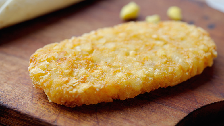 A hash brown sitting on a wood block