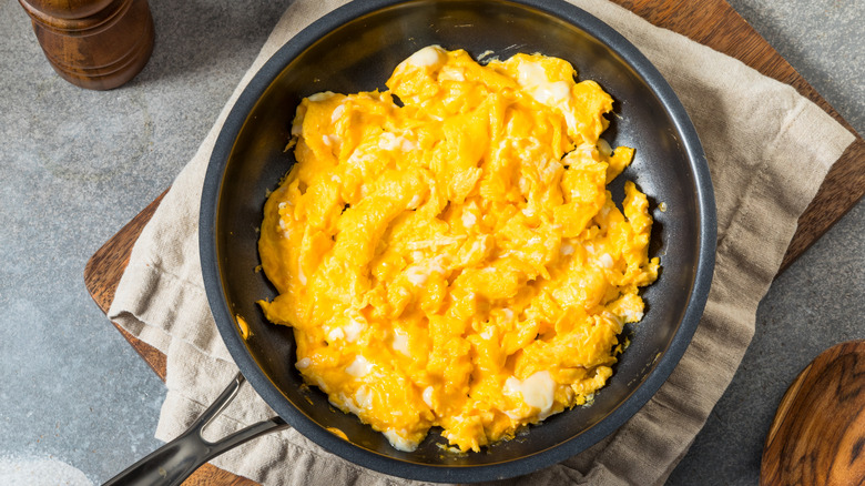 A pan of yellow scrambled eggs.