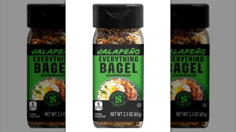 Shaker of Aldi's Stonemill Jalapeño Everything Bagel Seasoning on white background.