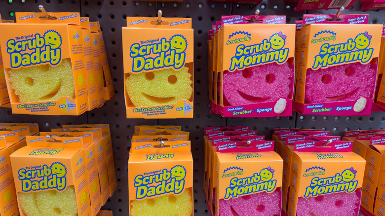 Scrub Daddy and Scrub Mommy sponges at a store in their packaging