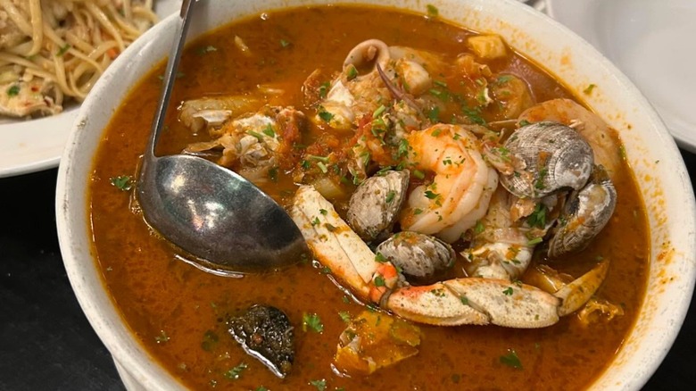 A photo of cioppino from Sotto Mare with a large portion of seafood