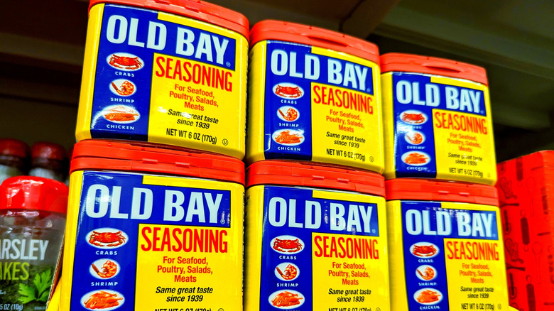 Old Bay seasoning containers on grocery aisle shelf.