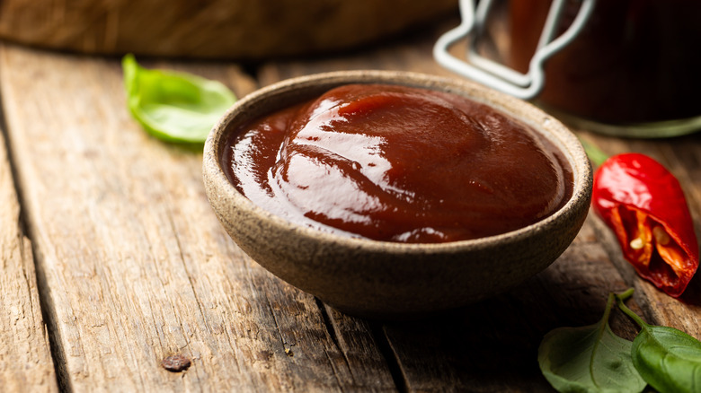 small bowl of steak sauce on wood table